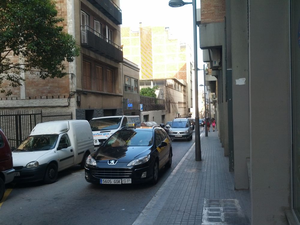 A difficult street to walk on, with heavy traffic and narrow sidewalk 18604252080